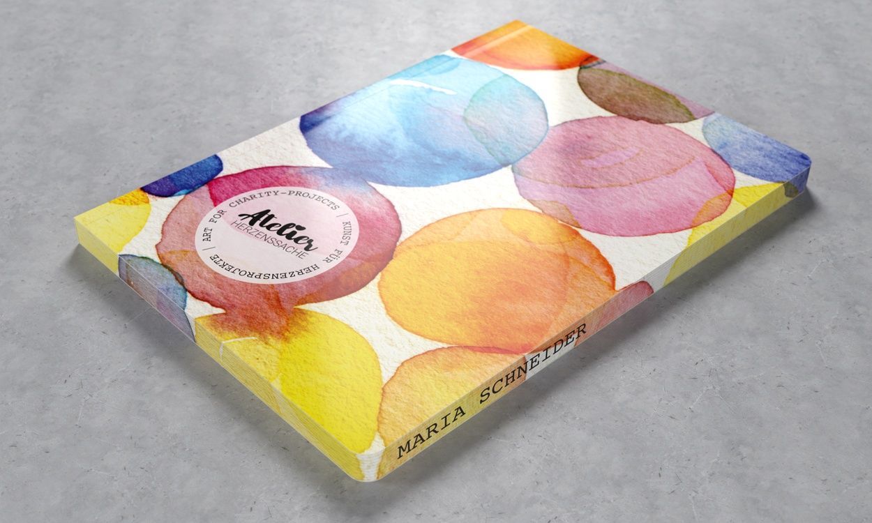 Personalisiertes Flexx-Book von Geiger-Notes, das mit einem Motivfarbschnitt veredelt wurde